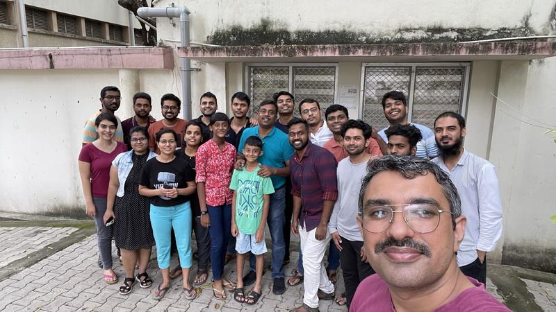 A group selfie outside the lab