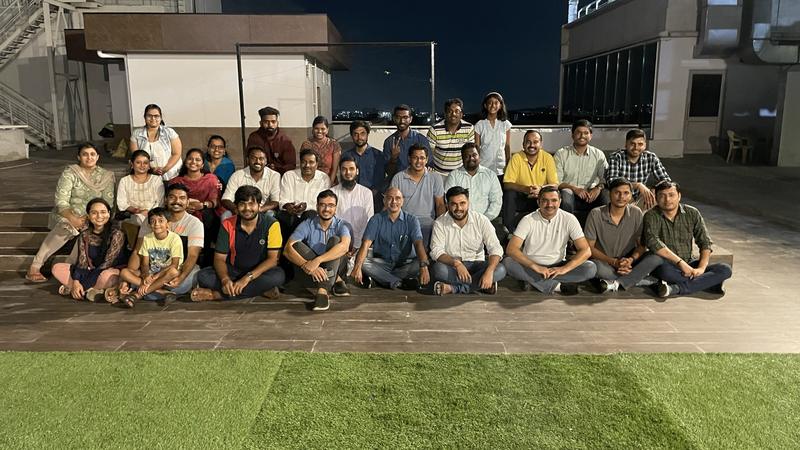 The group on a rooftop terrace in the evening