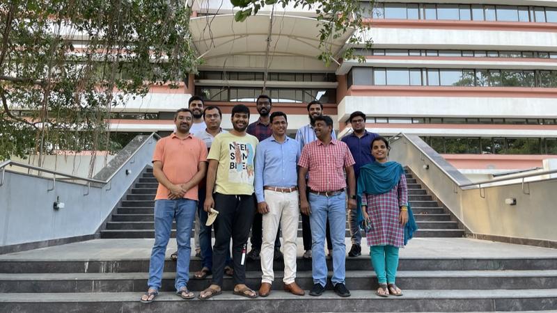 Group members on the campus steps