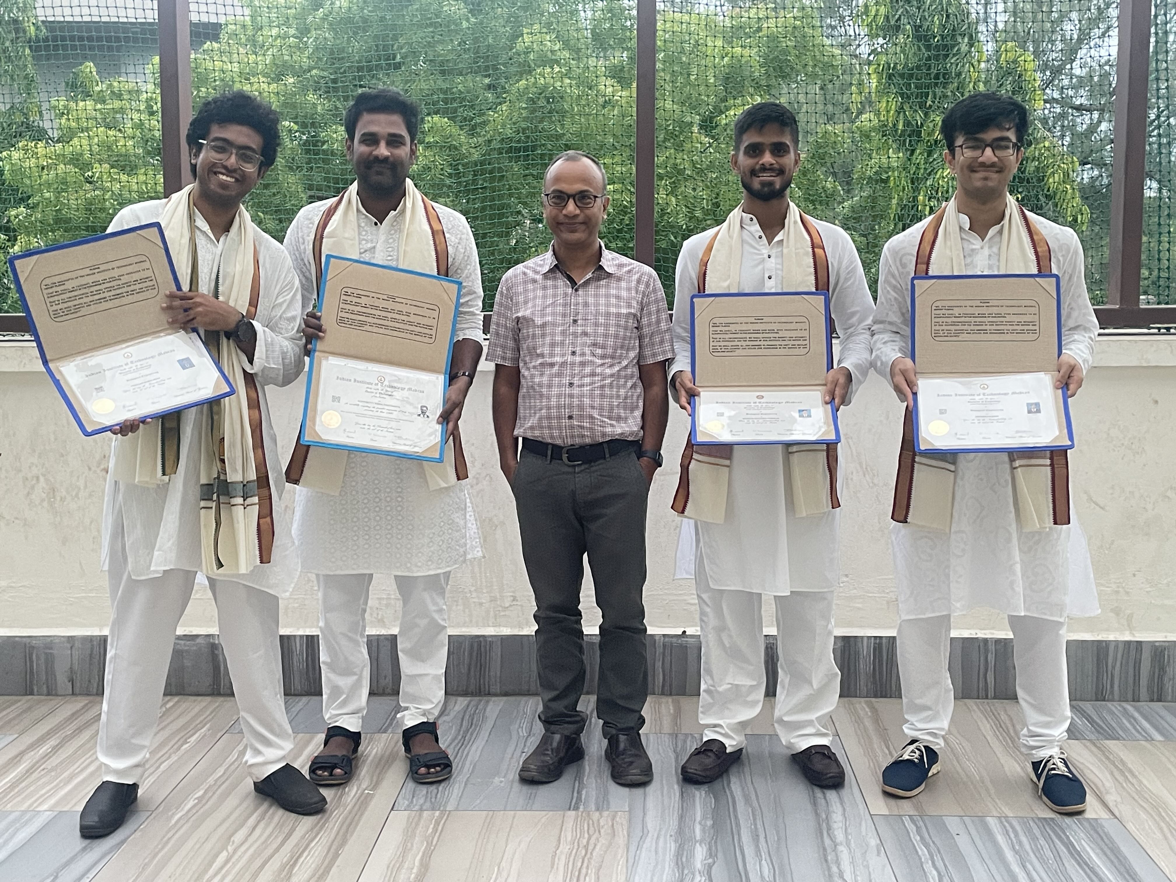 With graduands Dr Viswa Chaithanya, Aaryamaan, Devansh and Dhanush (2024)