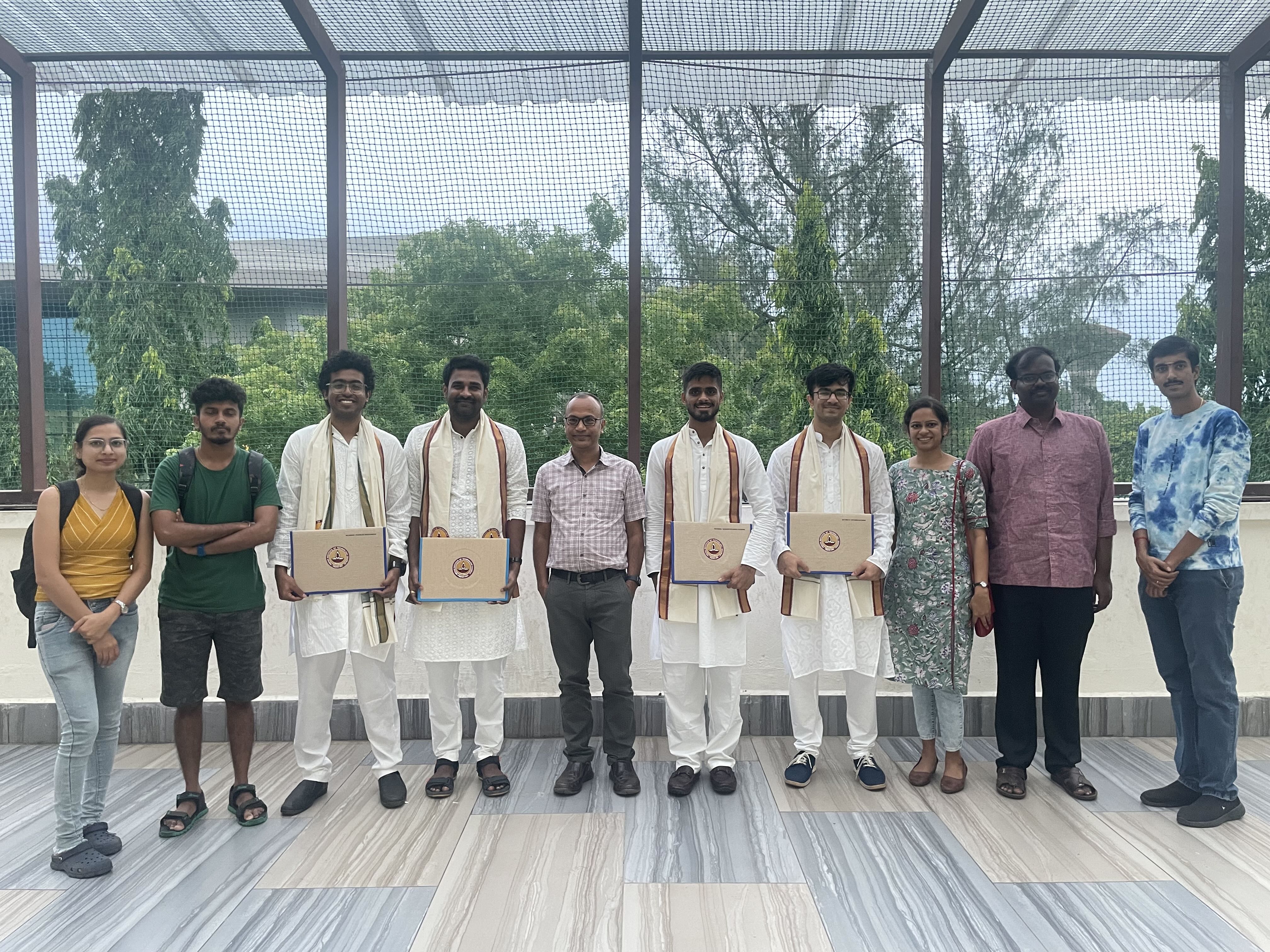 With graduands Dr Viswa Chaithanya, Aaryamaan, Devansh and Dhanush (2024)